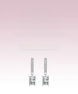 Detailed macro view of S925 silver earrings with rectangular cut zirconia and pave settings