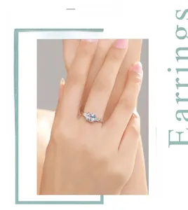 On-hand display of a square-cut sparkling 1ct silver solitaire ring with side stones