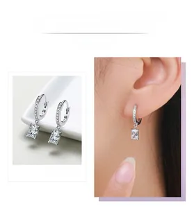 Macro shot of S925 sterling silver hoop earrings with rectangular cut zirconia pendant