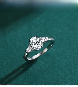 Close-up of s925 silver ring featuring an oval diamond and step-cut side stones