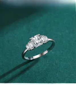 Macro detail of S925 silver ring featuring radiant and baguette cut simulated diamonds