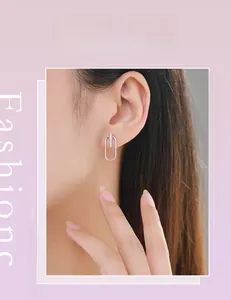 Detail of silver geometric rectangular stud earrings with micro-pave cubic zirconia inlay