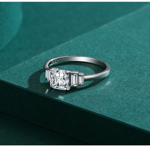 Macro detail of S925 sterling silver ring featuring radiant cut stone and baguette accents
