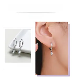 Macro shot of S925 sterling silver drop earrings with rhombic zirconia and silver stamp