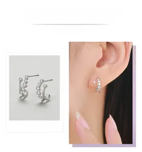 Macro detail and model view of S925 sterling silver double-row zircon stud earrings