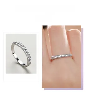 Detail view of a slim S925 sterling silver ring with micro-pave diamonds and hand model shot
