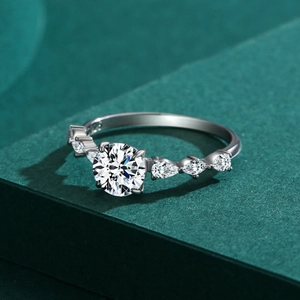 S925 sterling silver ring with 1 carat round center stone and pear-shaped side diamonds