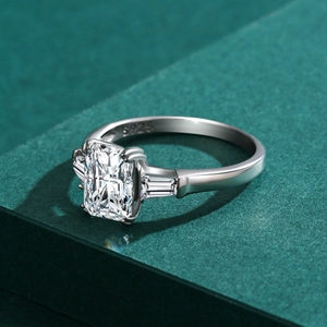 Luxurious S925 sterling silver ring featuring emerald cut cubic zirconia and trapezoid side stones