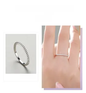 Detail shot of a slender S925 sterling silver ring featuring a row of sparkling pavé diamonds