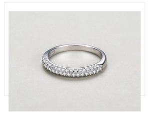 Macro detail of S925 sterling silver ring with double row pavé cubic zirconia setting