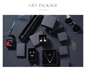 Elegant black textured gift boxes for necklaces and rings with minimalist gold branding