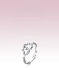 Close-up of S925 sterling silver interlocking double hearts ring with pavé-set zircons