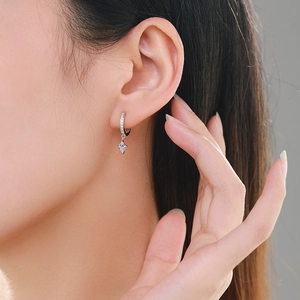 Elegant S925 sterling silver hoop earrings with rhombus zircon pendant worn by model