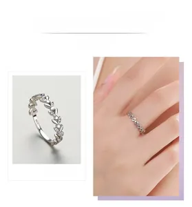 Macro detail of S925 silver leaf ring with micro-set diamonds for a minimalist look