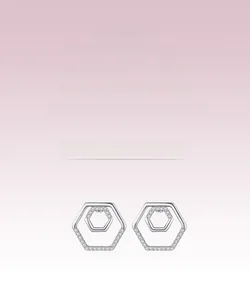 Macro detail of geometric S925 silver stud earrings with sparkling cubic zirconia inlay
