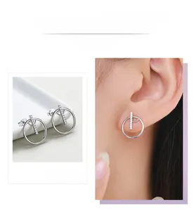 Detail display of silver geometric round stud earrings with shimmering micro-pave zircons