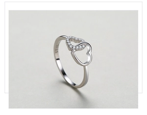 Macro shot of S925 sterling silver stamp and sparkling pavé heart ring details