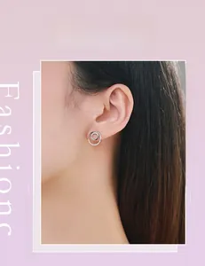 On-ear view of S925 sterling silver double hoop earrings with micro-set crystals