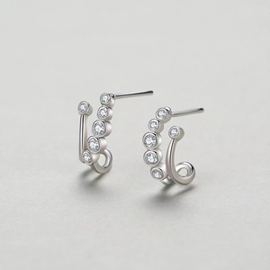 Elegant 925 sterling silver C-shaped stud earrings with five sparkling cubic zirconia stones