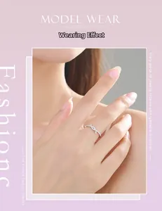 Detailed view of s925 silver twist ring with pavé micro-diamonds on a female finger