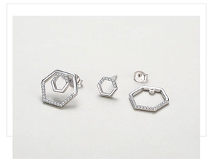 Macro view of geometric S925 sterling silver hexagon stud earrings with micro-set zircon