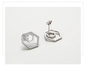 Close-up of S925 silver double hexagonal stud earrings with sparkling cubic zirconia