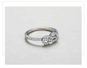 Macro detail of S925 silver infinity ring with micro-pave cubic zirconia setting