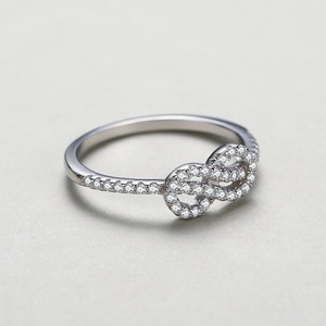 Polished S925 sterling silver infinity ring with pave-set shimmering zircon stones