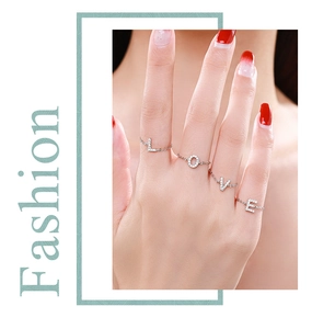 Close-up of S925 sterling silver chain rings with LOVE letters and pavé diamonds