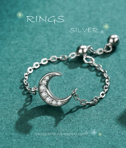 Macro detail of S925 sterling silver moon ring with micro-pave cubic zirconia crystals