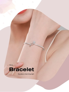 Close-up of S925 sterling silver bracelet with pavé zirconia stones on female wrist