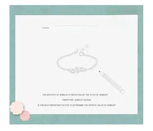 Artistic jewelry design sketch of an adjustable geometric silver ring with pencil and flowers