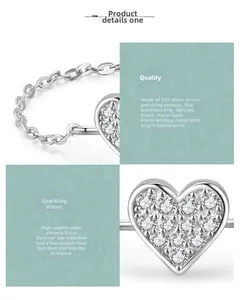 Detail of S925 sterling silver heart ring with pavé-set cubic zirconia and mirror polish