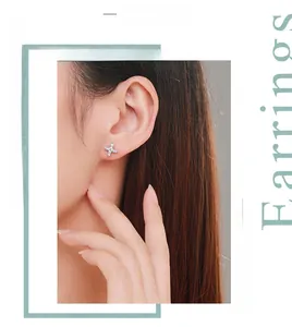 Close-up of S925 sterling silver star stud earrings with pavé micro-inlaid zircon stones