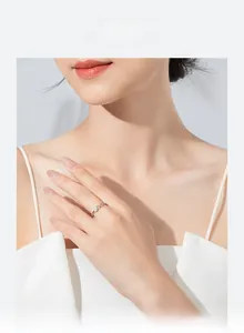 Close-up of a minimalist s925 silver geometric stacking ring on a female finger