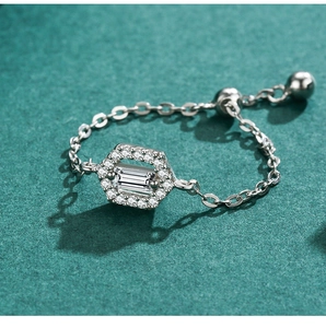 Macro shot of S925 silver chain ring with hexagonal pavé diamonds and adjustable bead