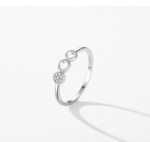 Macro shot of S925 sterling silver geometric ring featuring micro-pave zirconia circles