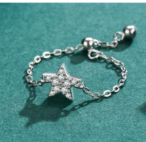 Detail of adjustable S925 sterling silver chain ring with pavé star pendant
