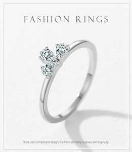 Macro shot of 925 silver ring featuring three pear-cut cubic zirconia in a cluster