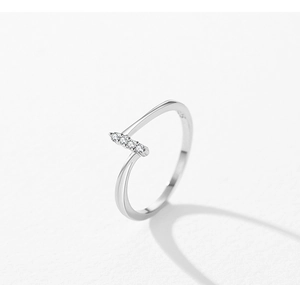 Macro view of 925 sterling silver open ring with horizontal bar and zircon inlays