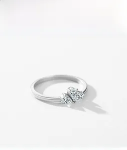 Detail of 925 silver ring featuring three pear-cut zircons in a crown cluster layout