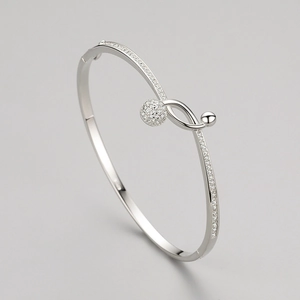 Elegant s925 sterling silver twist bangle with sparkling pavé crystals and polished finish