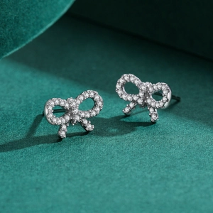 Elegant S925 silver bow stud earrings with micro-pave cubic zirconia crystals