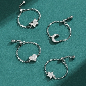 Adjustable S925 silver star and heart charm chain rings with shimmering cubic zirconia
