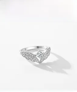 Macro detail of 925 sterling silver angel wing ring with round cubic zirconia center