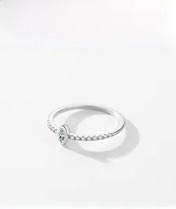 Detail of s925 silver ring featuring marquise-cut center stone and pave zircon setting