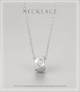 Macro detail of S925 silver cylinder pendant with pavé diamonds and square zircon stones