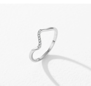 Macro detail of a 925 sterling silver wavy ring with shimmering zircon stones