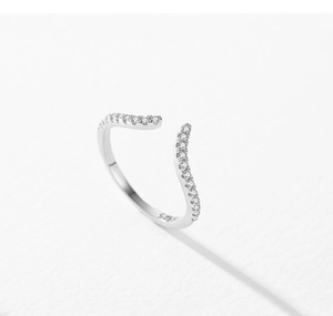 Macro shot of S925 sterling silver stamp and wave band with pavé set sparkling zircons
