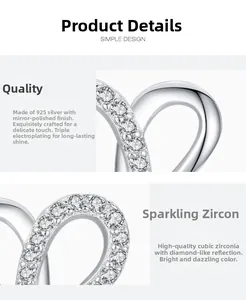 Detail of S925 sterling silver heart earring with polished finish and cubic zirconia